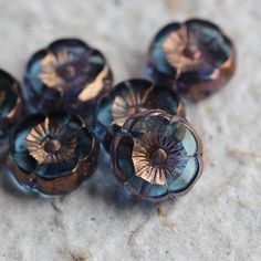 some very pretty glass beads on a table