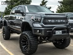 a large gray truck parked in a parking lot