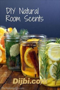 several jars filled with lemons, rosemary, and other things on a wooden table