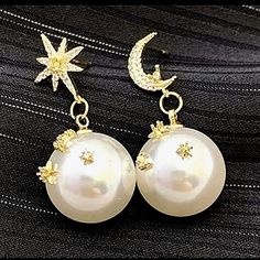 Star & Moon Post Earrings With Pearl Drops. The Pearl Drips Also Have Gold Moons And Stars On The Pearls With Gold & Clear Stones. I Have 2 Pairs Of These. They Are Brand New. Very Pretty! White Star-shaped Jewelry With Moon Charm, Elegant White Moon Charm Earrings, Elegant Round Earrings With Star Charm, Elegant White Earrings With Moon Charm, Elegant White Star-shaped Pearl Earrings, Star-shaped Moon Charm Earrings For Party, Moon Charm Star Shaped Party Earrings, Star-shaped White Pearl Earrings For Gift, White Moon Charm Jewelry For Party