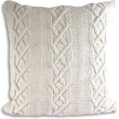 a white pillow with cable knitted on it's sides and the back side