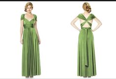 a woman in a long green dress with her hands on her hips