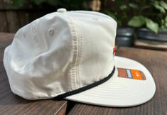 Y'all loved 'em, so we had to bring them back... Only better! Our exclusive Boss and Sauce Stros’ design on a Outdoor Richardson Rope hat. Get ready to be back at Minute Maid Park cheering on your favorite baseball team. The back of the hat features a snap closure for easy adjustments. We chose this exclusive off white colorway to help keep that hat from getting so dirty! White Flat Bill Sun Hat For Outdoor, White Adjustable Snapback Sun Hat, White Flat Brim Baseball Cap For Outdoor, White 5-panel Sports Hat, Adjustable Flat Brim Hat For Baseball Season, Cream Flat Bill Hat For Outdoor, Casual White Hat Bands For Outdoor, Casual White Hat Band For Outdoor, White Flat Bill Dad Hat For Outdoor