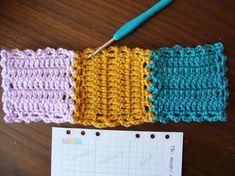 the crocheted squares are next to a ruler