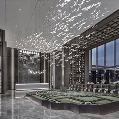 a large room with many chandeliers hanging from the ceiling