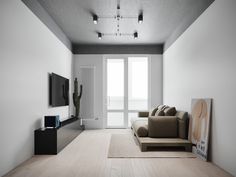 a living room filled with furniture and a flat screen tv on top of a wooden floor