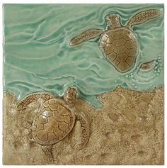 two sea turtles swimming in the ocean