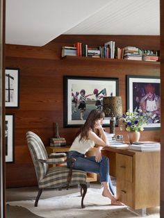 a woman sitting at a desk in an office