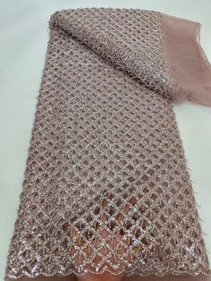 This high quality Fabric is measured in 5 Yards With Embroidered Beading and Sequin. It is soft, very delicate and beautiful. This high Quality Fabric is made with Fashion embroidered rhinestones can be used in making party wedding dresses, skirts, shawls, scarves and other other fashion apparels as you would like. Size : Length : 5 yards (180 inch). Width: 50 inch (Please allow slight deviation for the measurement data ,±1 inch) Material: 100% Polyester, Tulle Lace Fabric, Eco-Friendly embroide Elegant Embroidered Net Tulle Fabric, Elegant Embroidered Net Fabric With Sequins, Elegant 3d Embroidered Fabric For Party, Elegant Net Sequin Fabric, Elegant Pink Fabric With 3d Embroidery, Elegant Embroidered Fabric With Rhinestones For Festive Season, Elegant Embroidered Fabric With Rhinestones For Festive Occasions, Elegant Sequined Fabric For Festive Occasions, Elegant Pink Embellished Tulle Fabric