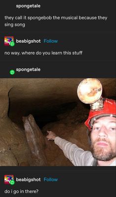 a man wearing a hard hat standing in a cave with his hand up to the ceiling