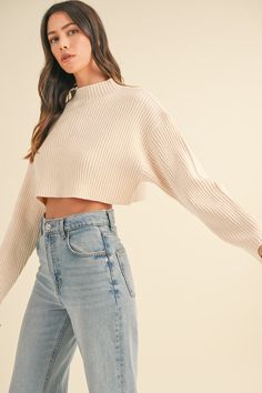 Get ready for effortless layering with the Lauryn Mock Neck Cropped Sweater. This long sleeve, cropped sweater features a chic mock neckline + soft, ribbed material that feels as good as it looks. Its neutral color makes it endlessly versatile—perfect for pairing with your favorite denim or layering over tank dresses to seamlessly transition your wardrobe into Fall + Winter. A must-have for cozy, stylish vibes all season long! Key Features: Long sleeve cropped style Mock neckline Soft, ribbed ma Tank Dresses, Cropped Long Sleeve, Crop Sweater, Mock Neckline, Cropped Style, Sweater Black, Ribbed Sweater, Cropped Sweater, Black Media