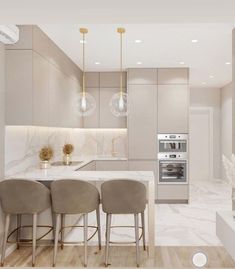 a modern kitchen with marble counter tops and bar stools