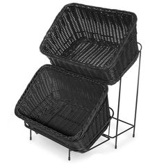 two black wicker baskets sitting on top of each other