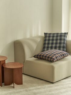 a living room scene with focus on the couch and coffee table in the foreground