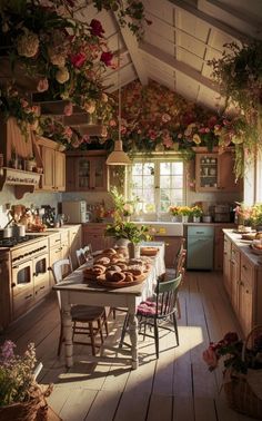 a kitchen with lots of flowers hanging from the ceiling