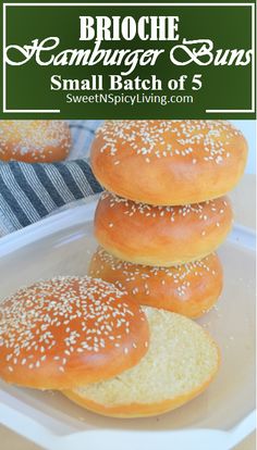 small batch of brioche hamburger buns on a white plate with text overlay