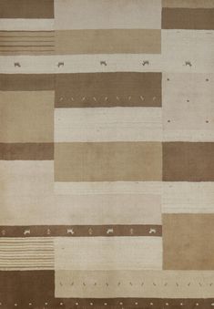 an area rug with different colored squares and lines on the ground, all in various shades of brown