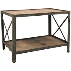 a metal table with two shelves on each side