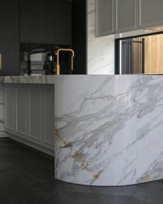 a large marble counter top in a kitchen