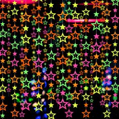 multicolored stars are hanging from strings on a black background with red, green, and blue lights