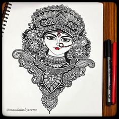 a drawing of a woman's face in black and white with intricate designs on it