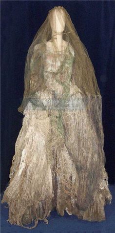 a mannequin wearing a veil and dress