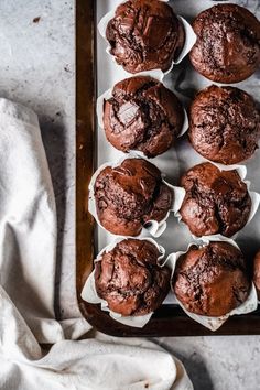 chocolate muffins on a baking tray ready to be eaten