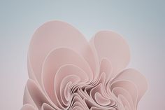 an abstract pink flower is shown in the middle of this image, it appears to be made out of paper