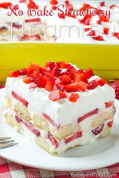 a piece of cake with strawberries on top is sitting on a plate next to a fork