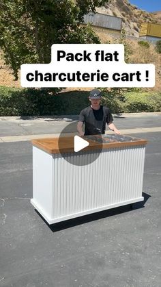 a man standing next to a white box in the middle of a parking lot with text reading pack flat charlotte cart