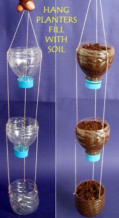 three hanging planters filled with soil and an acorn on the top one is empty