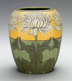 a vase with flowers painted on it