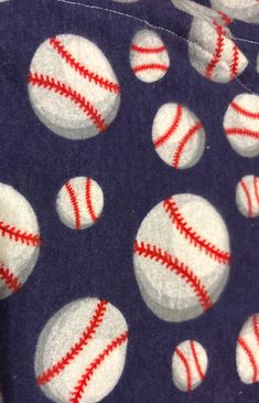 several baseballs on a purple background with red and white stitching around the edges