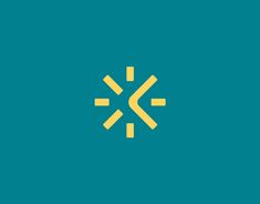 a yellow and blue logo with the letter k in it's center on a teal background