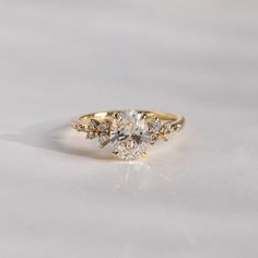 a yellow gold engagement ring with three stones