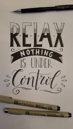 the words relax nothing is under control written in black ink on a white paper next to two crayons