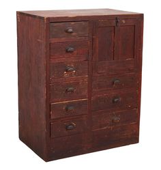 an old wooden cabinet with many drawers