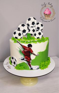 a soccer themed birthday cake with cupcakes on top