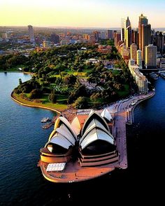 an aerial view of the sydney opera house and surrounding cityscape in australia's capital