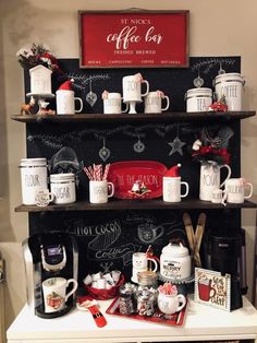 a shelf with coffee mugs and other items on it in front of a chalkboard