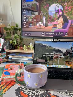 a laptop computer sitting on top of a desk next to a cup of coffee and a mouse