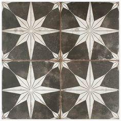 a black and white tile with stars on it