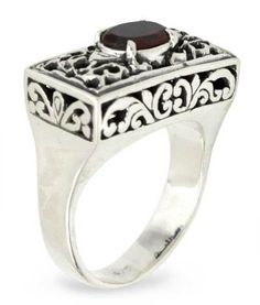 Superbly crafted of sterling silver this design is the creation of Buana in Bali. Crowning ornate filigree settings a faceted garnet the January??s birthstone takes center stage in a ring of feminine elegance. .925 Sterling silver Oval Garnet Jewelry With Intricate Design, Garnet Rings With Intricate Design For Gift, Garnet Ruby Ring With Intricate Design As Gift, Oval Garnet Filigree Jewelry, Ornate Filigree Garnet Jewelry, Ornate Garnet Filigree Jewelry, Ornate Filigree Ring With Stone Setting, Ornate Sterling Silver Ruby Ring, Ornate Ruby Filigree Ring