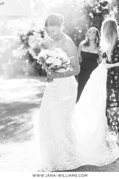 the bride is walking down the aisle with her friends