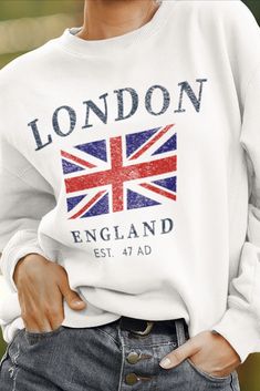 .: 50% Cotton 50% Polyester .: Medium-heavy fabric (8.0 oz/yd² (271.25 g/m²)) .: Loose fit .: Sewn in label .: Runs true to size #londonengland #londoncrewneck #londonsweater #womenslondonshirt London Souvenirs, Jumper Designs, England Flag, Bath England, Uk Flag, British Flag, Look Plus, Print Pullover