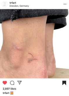 a person with a small tattoo on their foot that says, i love you in german