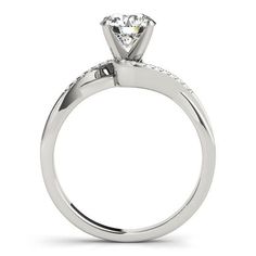 a white gold engagement ring with diamonds on the side