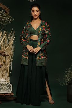 Green longline blazer with all-over multi colored floral patterns and embroidered highlights. Comes with embroidered bustier and box pleated pant.
Components: 3
Type Of Work: Floral
Neckline: V-Neck
Sleeve Type: Full
Fabric: Silk, Lining: Butter Crepe
Color: Green
Other Details: 
Attached lining
High waisted pant
Length:
Jacket: 32 inches
Pant: 42 inches
Occasion: Destination Wedding,Sangeet - Aza Fashions Embroidered Fitted Front Open Sets, Embroidered Bustier, Pleated Pant, Pant Length, Pleated Pants, Fabric Silk, Box Pleats, Green Silk, Pant Set