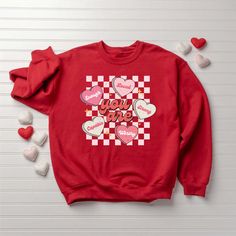 Introducing our exquisite Women’s Valentine’s Day Sweatshirt, a heartwarming garment designed to make this special occasion even more memorable. Whether you’re celebrating love with your significant other or simply spreading the joy among friends and family, this cozy sweatshirt is the perfect choice to express your affection. Crafted with utmost care, our Valentine’s Day Sweatshirt embodies love and warmth in every stitch. One of the standout features of this sweatshirt Valentines Sweatshirt, Valentines Day Sweatshirt, Valentine Sweatshirt, Retro Heart, Love Sweatshirt, Style T Shirts, Heart Sweatshirt, Sweatshirt For Women, Cool Countries