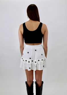 We are obsessed with this white skirt with black stars! There is an added ruffle detailing along the middle. It is lightweight and flouncy which is perfect for any season. The waistband is elastic and has built in shorts! Model Info Meet Christina. Here she is wearing a size small! Hips: 37" | Waist: 25" | Bust: 32" | Height: 5'6" The Details Ruffle Detailing Elastic Waistband Built In Shorts Black Stars Hand Wash Cold, Hang To Dry Or Dry Clean Self: 100% Rayon, Lining: 100% Polyester [#other] H White Star Print Summer Bottoms, Summer White Star Print Bottoms, White Summer Bottoms With Star Print, White Ruffled Bottoms For Night Out, Small Hips, Star Skirt, Dancing In The Moonlight, Black Stars, Skirt White